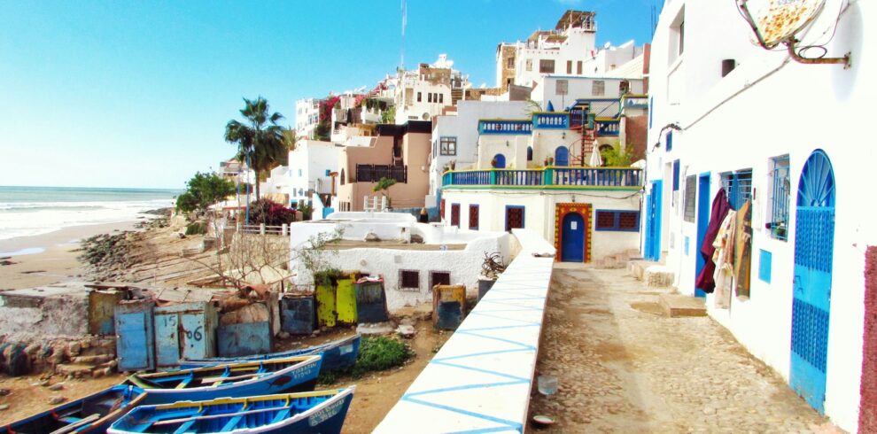 boatd docked near houses and body of water