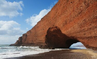 brown rock formation on sea shore during daytime